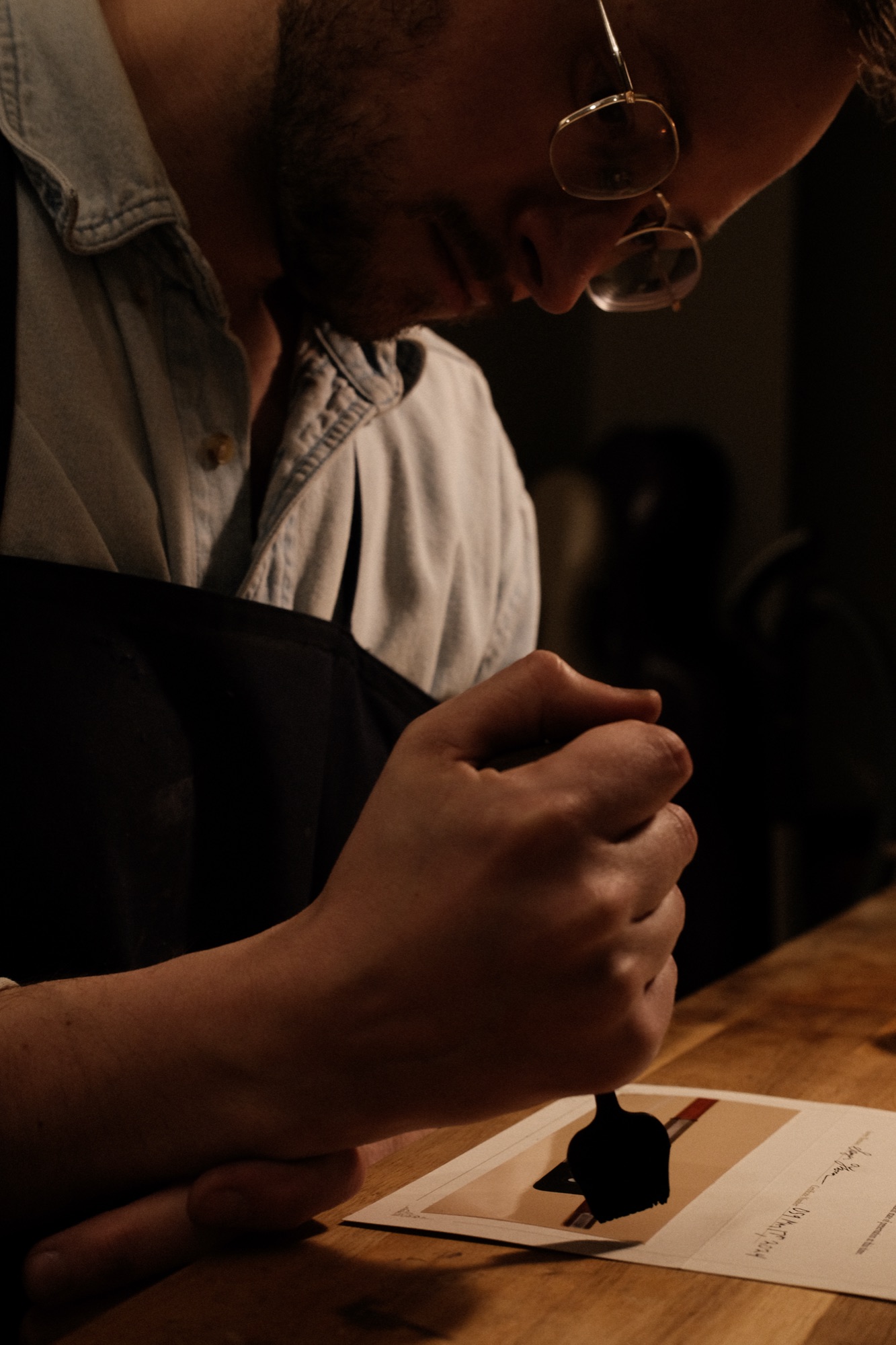 Sawyer Thomson sealing a certificate of authenticity